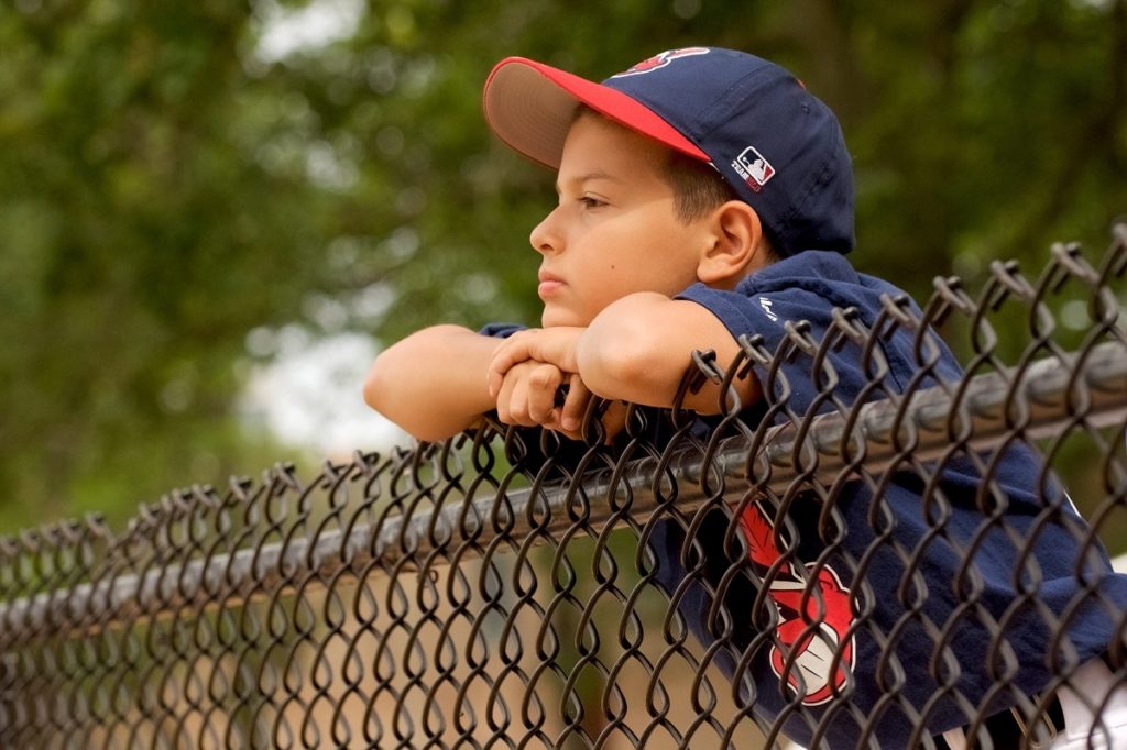 Little kid in baseball uniform