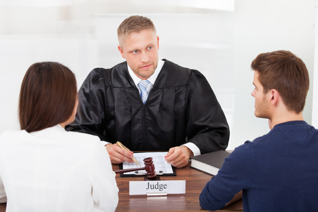 divorcing couple in front of the judge