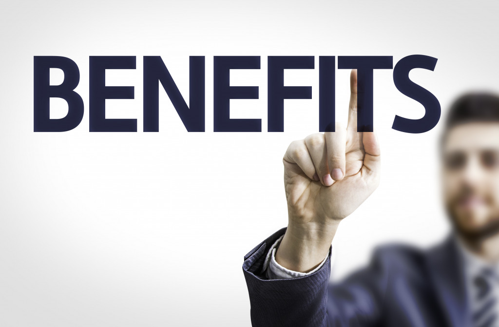 a person writing benefits