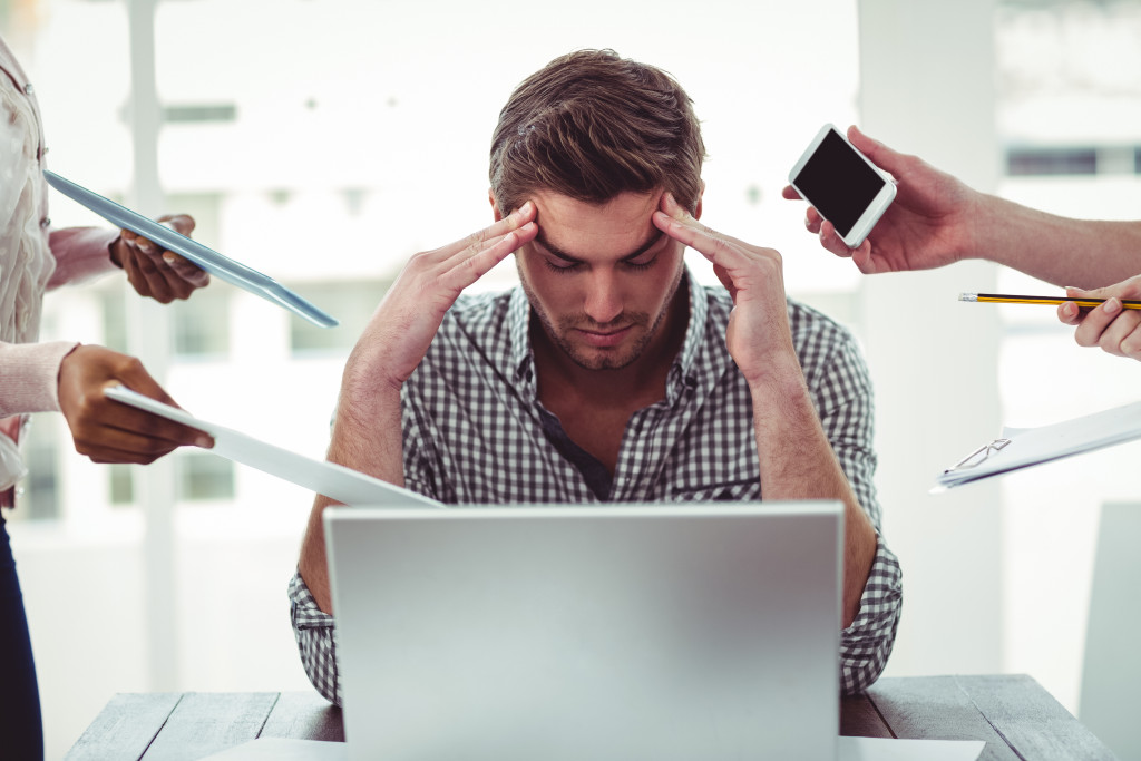 Business owner stressed with too much work