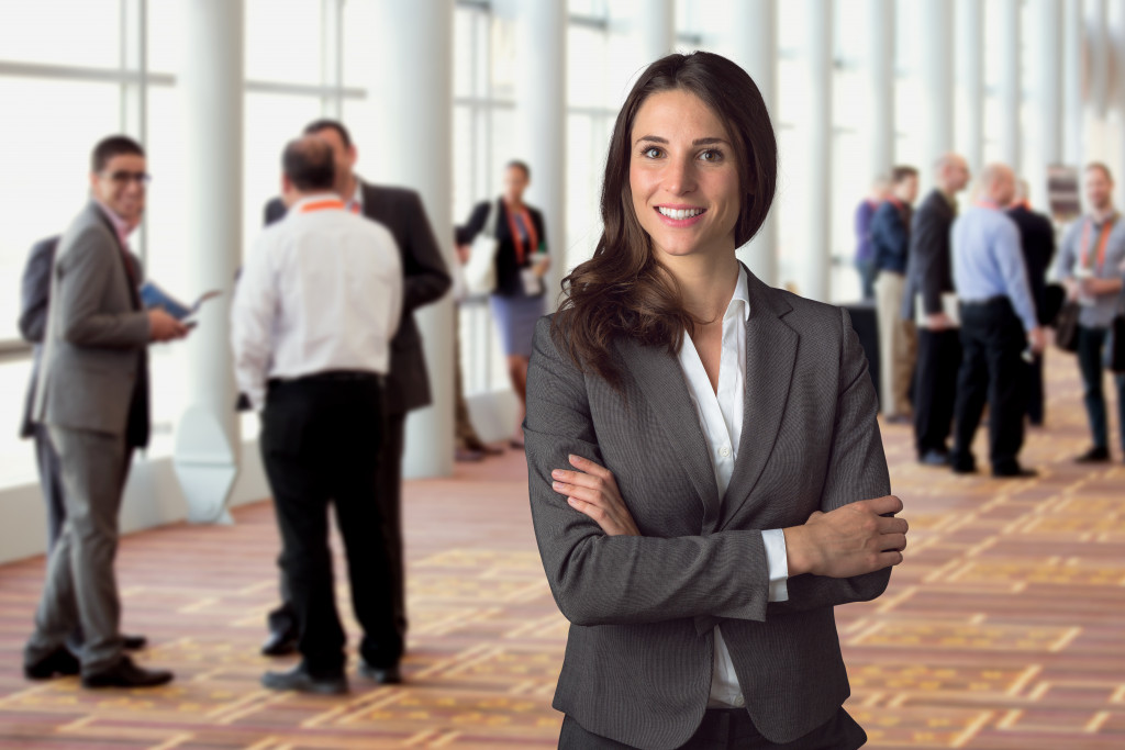 female in corporate attire at an event