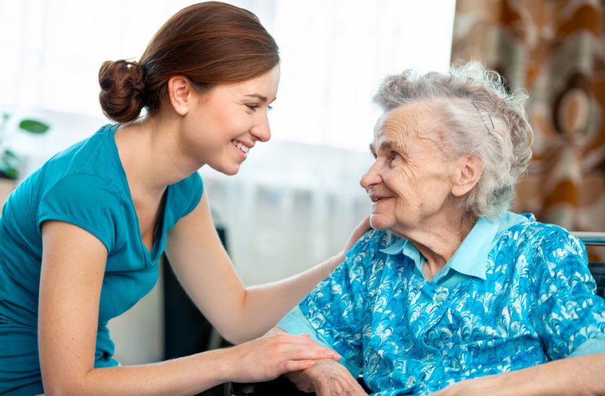 A woman caring for an elderly lady