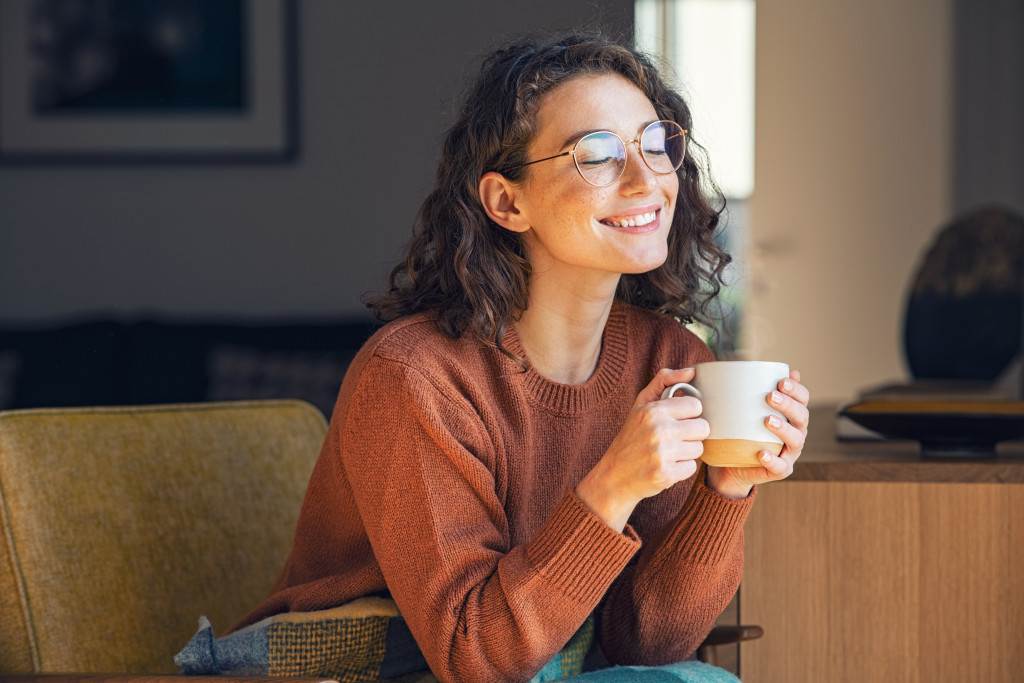 woman drinking coffee at home